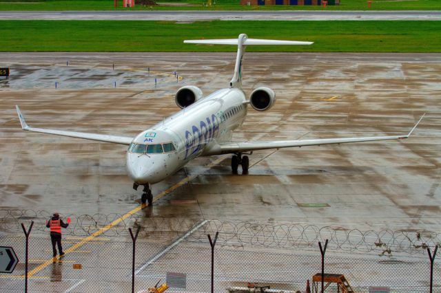 Canadair Regional Jet CRJ-900 (S5-AAK) - In Manchester airport.