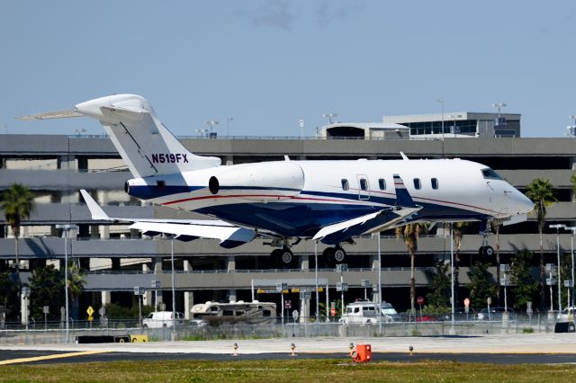 Bombardier Challenger 300 (N519FX) - Over the threshold of RWY 1R. 2/19/2015. Test of the new Nikon D750.