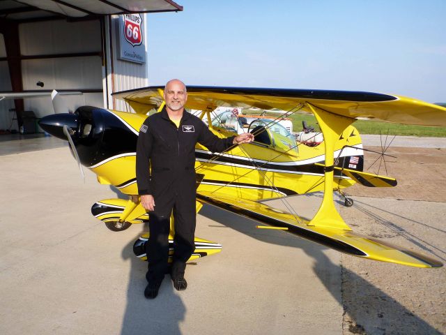 Beechcraft King Air 90 (N79JM) - Photo of Jim Achord of Chris and Jim's Flying Circus standing in front of their 1977 Mills Pitts Special S-1S experimental acrobatic biplane. Photograph courtesy of Mike Arlow was taken on the afternoon of May 16, 2012 while on a fuel stop at the Courtland Alabama Ariport.