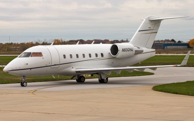 Canadair Challenger (N650HJ) - A Bombardier Challenger 604, Operating as Hop-A-Jet 650 taxi's into the parking area at KVPZ.