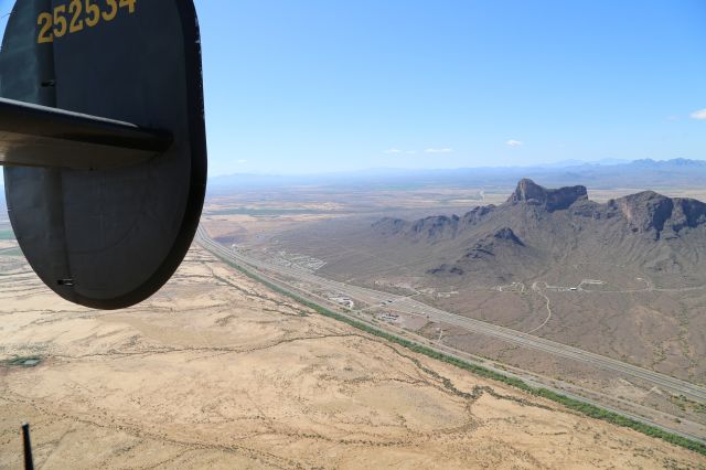 Consolidated B-24 Liberator (N224J) - Collings Foundation "Wings of Freedom Tour," 9 Apr 16, at Marana Regional Airport, AZ.  B-24J, Witchcraft, NX224J.  Looking south at Picacho Peak and I-10 Exit 219.