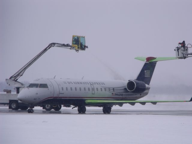 Canadair Regional Jet CRJ-200 (N462AW) - being de-iced at Ottawa.