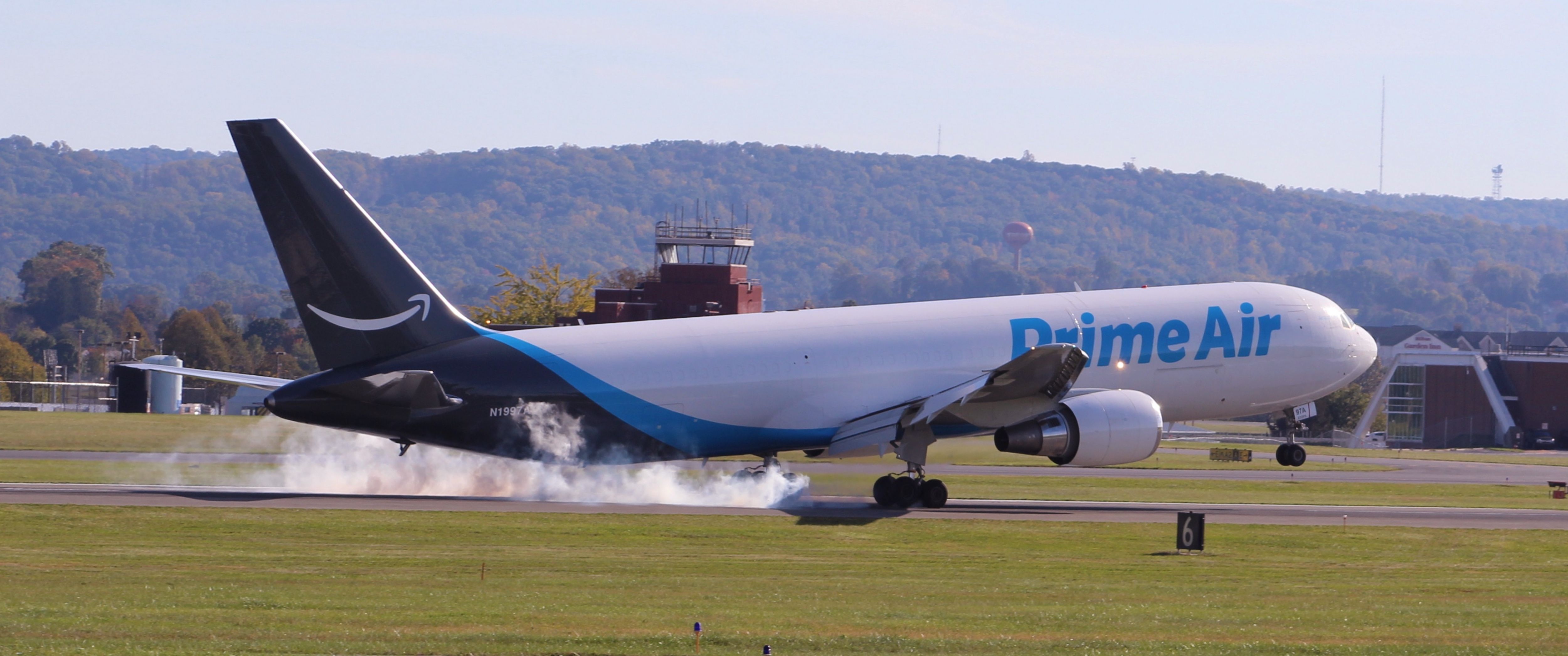 BOEING 767-300 (N1997A) - Giant 3026 Heavy touching down on runway 24