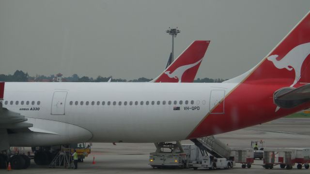 Airbus A330-300 (VH-QPD) - At Changi Airport.  One of the last Qantas planes to fly to Perth internationally.  (QANTAS INTERNATIONAL FLIGHTS FROM PERTH HAVE BEEN DISCONTINUED).  Sitting at starbucks at Changi Internation Airport.