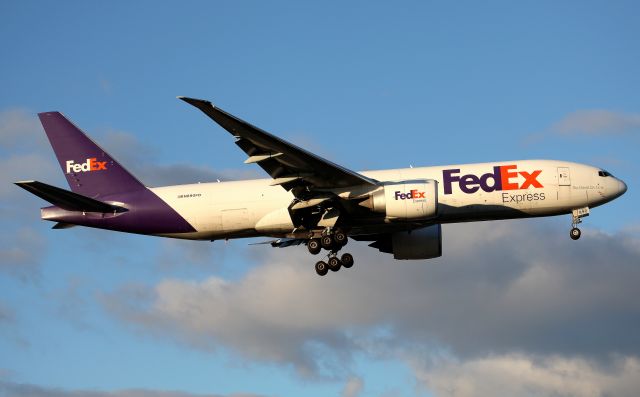 BOEING 777-200LR (N890FD) - Replacing the MD-11 from Singapore.Short Final to Rwy 16R