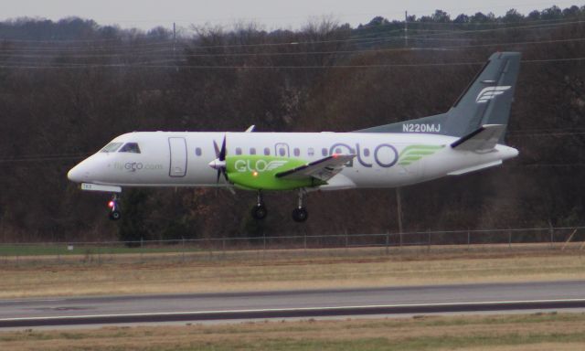 Saab 340 (N220MJ) - A Glo Airlines SAAB 340 approaching touchdown on Runway 18R at Carl T. Jones Field, Huntsville International Airport, AL - December 28, 2016. Shot with a Canon T5 in sports mode on a monopod from Level 5 of the parking deck.