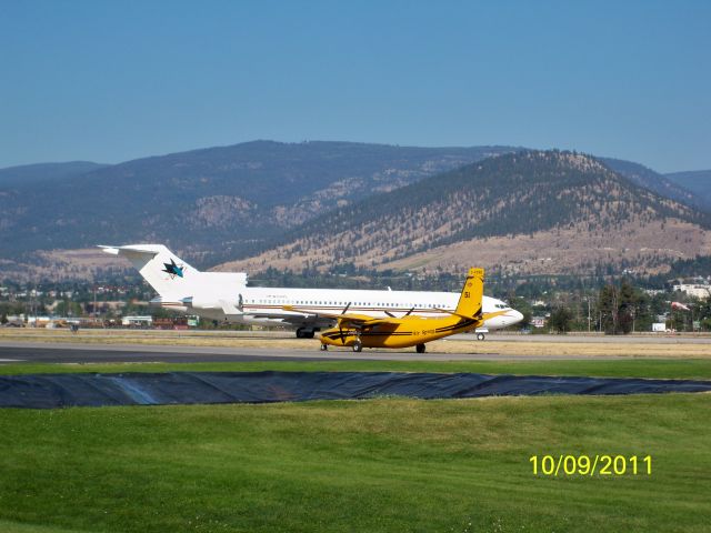 Rockwell Turbo Commander 690 (C-FZRQ) - Air tanker Bird-dog at Penticton Regional Airport Forest Services Tanker Base Canada. Boeing 727-200 in background.