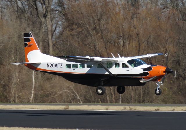 Cessna Caravan (N208FZ) - Landing runway 14 at DTN by Carl Hennigan