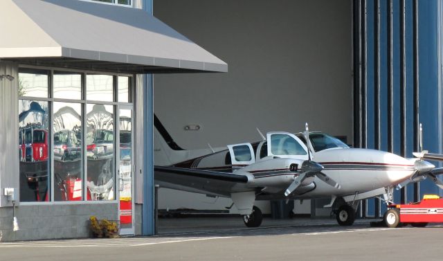 Beechcraft Baron (58) (N95PJ) - At RELIANT AIR. Thay have the lowest fuel price on the Danbury (KDXR) airport.