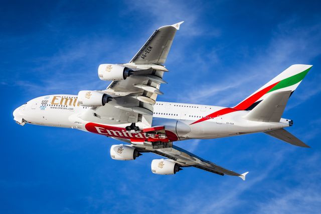 Airbus A380-800 (A6-EEM) - Over the beach after departing RWY 24L.