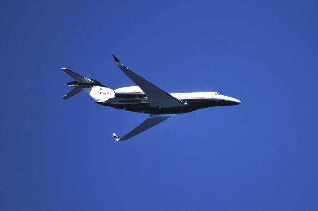 Cessna Citation CJ3 (N202KC) - Taken from our whale watching catamaran, "Manu Iwa", with Ocean Sports Waikoloa. N 202KC did a low and slow cruise offshore Waikoloa.