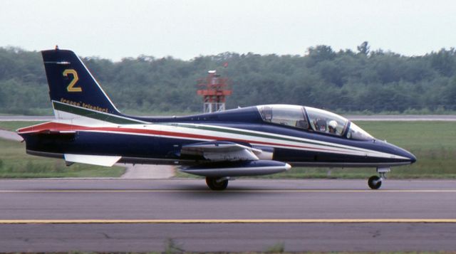 AERMACCHI MB-339 — - McGUIRE AIR FORCE BASE, WRIGHTSTOWN, NEW JERSEY, USA-AUGUST 1986: Performing at the August 1986 Open House and Air Show was the Italian Air Force Aerobatic Team "Frecce Tricolori" (Three-Colored Arrows). 