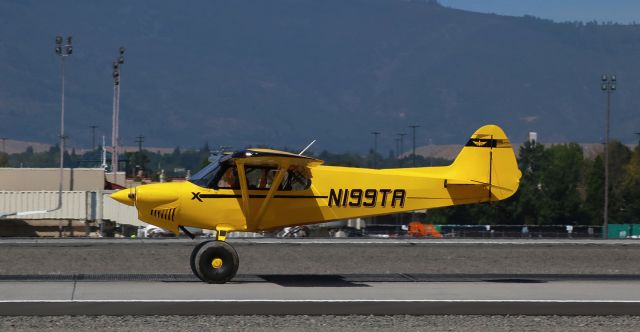 CUB CRAFTERS CC-19 XCub (N199TA) - After landing a couple hundred feet past the 16L keys, Pilot Ryan M. holds the tailwheel in the air as he hustles N199TA down the runway in order to get to Juliet Taxiway and exit 16L to clear the way for a Volaris Bus on very short final behind him.