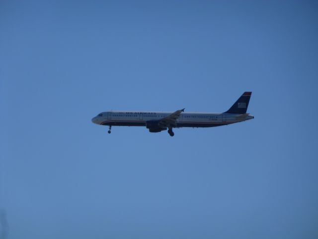 Boeing 757-200 (N182UW) - US Airways 757-200 from Newark approaching Tampa.  Unfortunately it was landing on the east runway -- wrong side of the sun!