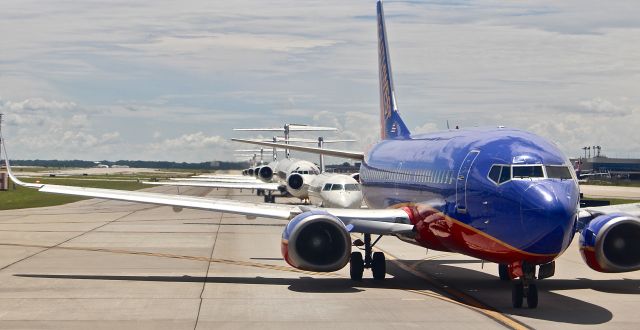 BOEING 737-300 (TRAFFIC) - Typical Atlanta traffic, with JT8Ds dominating and the occasional regional jet. Sadly, in a few years, the JT8Ds will start to become far and few between. Ironically, in the foreground is a SW 737-300, which has already been retired (this photo is a year old).