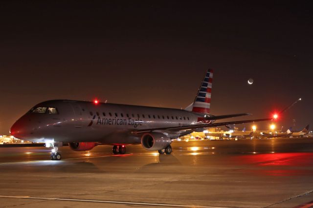 Embraer 175 (N435YX) - Monday morning crescent moonrise behind AA4467 on Pad-1 on 23 Dec 2019. Next stop, sunny Miami. 