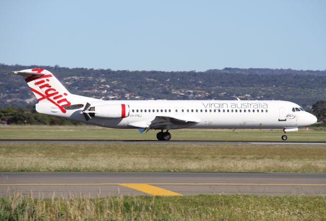 Fokker 100 (VH-FNJ) - Touching down on Rwy.23 at Adelaide Airport.