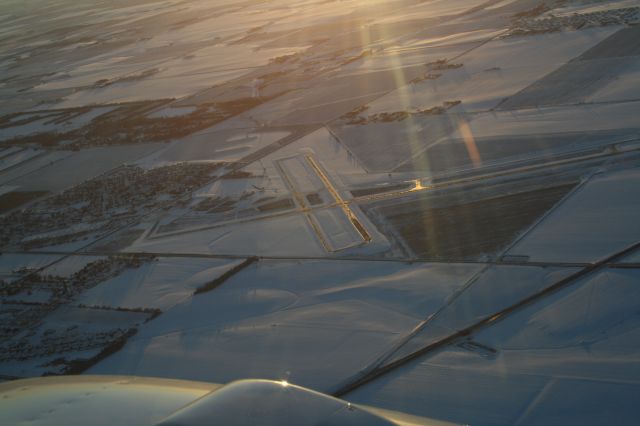 Beechcraft 55 Baron (N7750R) - edge of a winter day and an icy runway