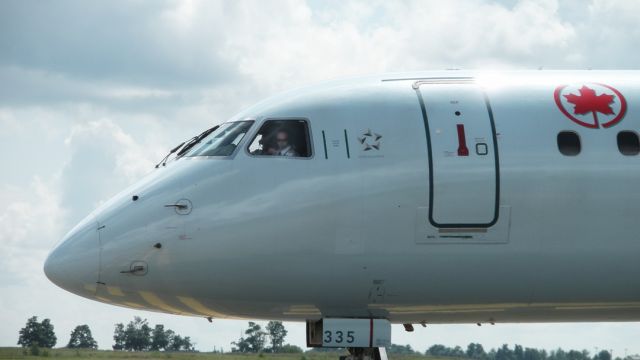 C-FMZD — - Captain about to wave as he taxis to Runway 25 2009:08:11. 14:45