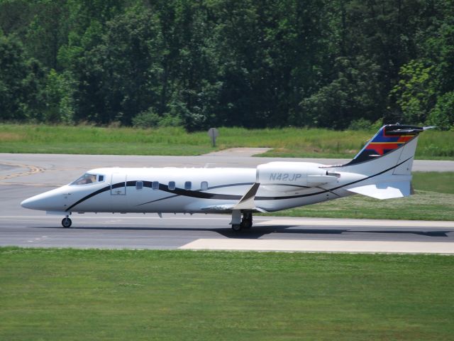 Learjet 60 (N42JP) - WELLS FARGO BANK NORTHWEST NA TRUSTEE (NASCAR driver Juan Pablo Montoya) take-off roll on runway 20 at KJQF - 5/31/12