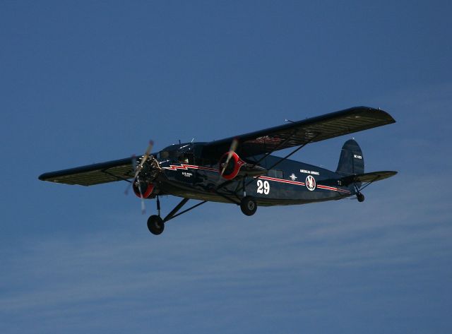 Ford Tri-Motor (N11153) - Stinson Tri-Motor with AA marking during fly by at the EAA Fly In 7-29-2005. There were 4 tri-motors flying at the same time during the show.