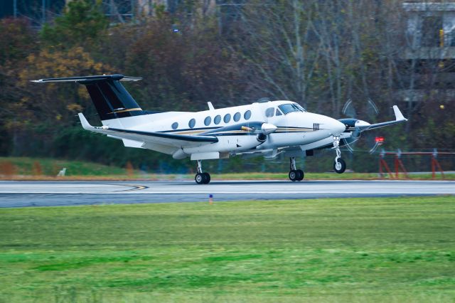 Beechcraft Super King Air 200 (N197AS) - N197AS is a 1997 Beechcraft King Air B200 seen here touching down at Atlanta's PDK executive airport. I shot this with a Canon 500mm lens. Camera settings were 1/250 shutter, F4, ISO 250. Please check out my other photography. Votes and positive comments are always appreciated. Questions about this photo can be sent to Info@FlewShots.com