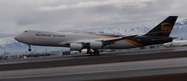 BOEING 747-8 (N617UP) - Takeoff with wingtip vortices, viewed from west side of Runway 15-33