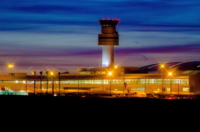 — — - Toronto YYZ Control Tower & Terminal 1 at night.