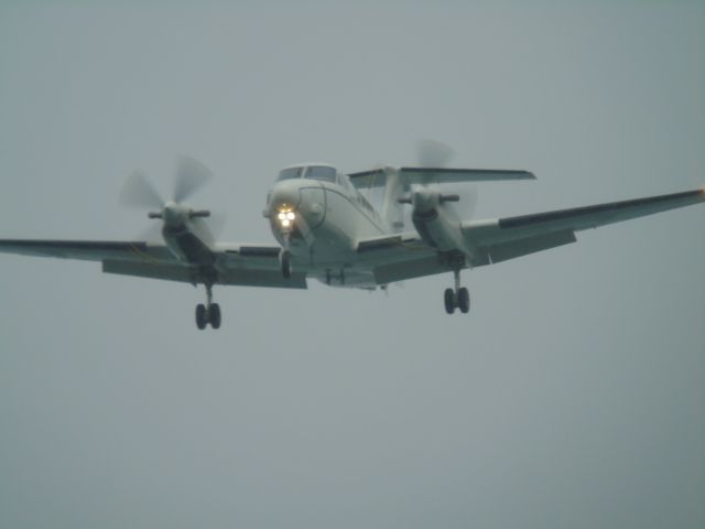 8400162 — - A few seconds till touchdown at around 5:45pm on Monday the 20th in heavy rain. On approach over the pacific ocean to NAS Whidbey Island. Aircraft is a Beechcraft UC-12 Huron, anyone know an icao code?