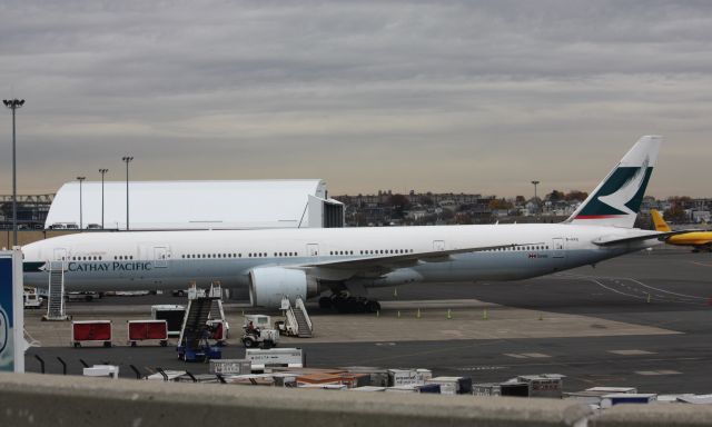 BOEING 777-300ER (B-KPG) - Cathay Pacific seen in day light hours at BOS which is unusual. They arrive and depart during the evening, making this a nice treat to see.