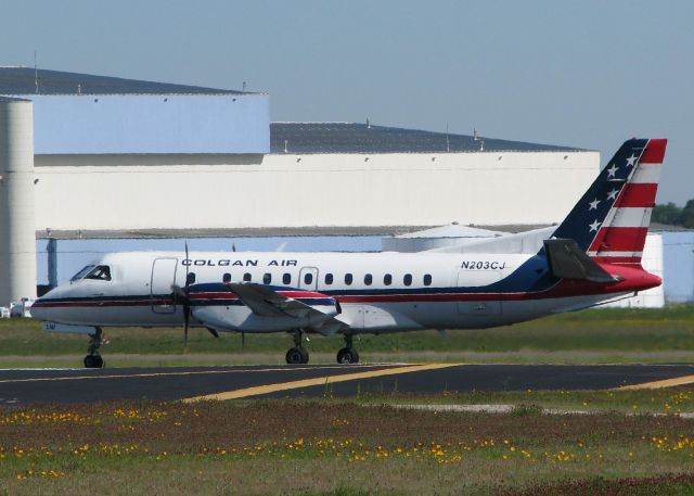 Saab 340 (N203CJ) - Turning onto runway 32 at the Shreveport Regional airport.