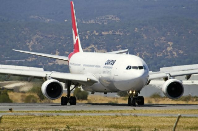 Airbus A330-300 (VH-QPD) - Turning on to the taxi-way, heading for Terminal 1, after landing on runway 23 on arrival from Sydney en-route to Singapore, on the last day of the Australian summer. Thursday 28th February 2013.