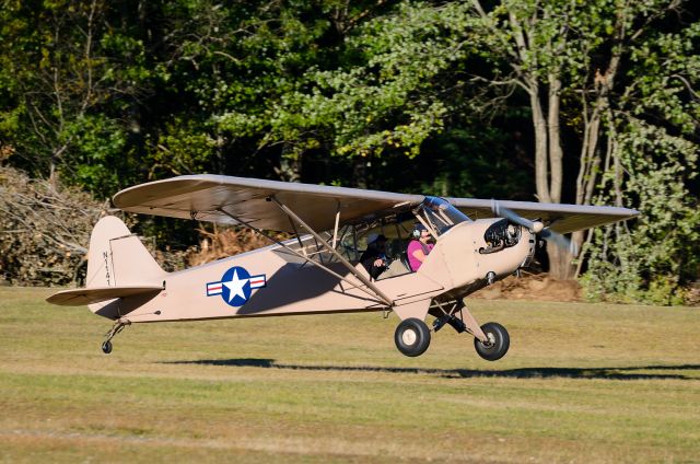 Piper NE Cub (N1141V) - 1943 PIPER J3C-65 touching down at Hampton Airfield, NH.