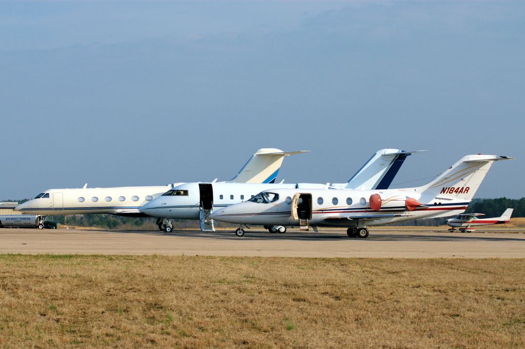 Beechcraft Beechjet (N184AR) - Three pretty business jets on the ramp at the LaGrange-Callaway Airport - LaGrange, GA