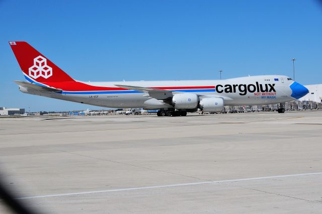 BOEING 747-8 (LX-VCF) - Shooting through the chain link fence at north cargo on 09-04-20