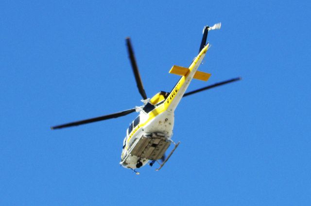 Bell 412 (N120LA) - Lifting off from Brackett Field.