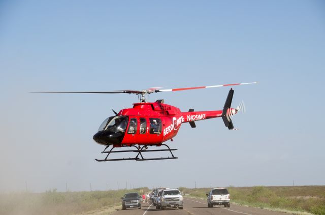 Bell 407 (N429MT) - Aerocare 6 lifting off with a patient in Pecos county Texas