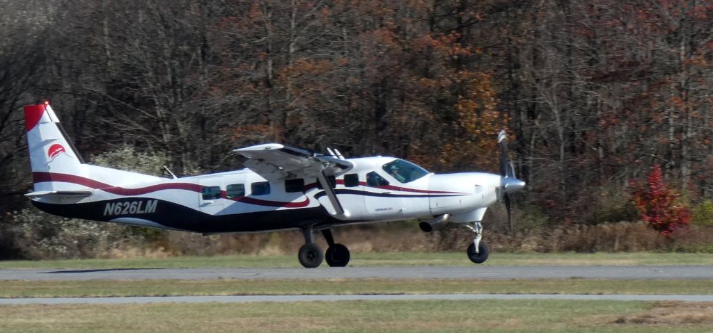 Cessna Caravan (N626LM) - Shown on departure is this "Skydive Sussex" 1998 Cessna 208B Grand Caravan heading to 14,000 feet for another Skydive deployment in the Autumn of 2024.