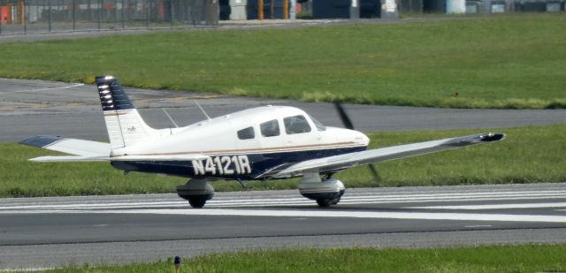 Piper Cherokee (N4121R) - Shown on the departing runway is this 1998 Piper Cherokee PA-28-181 in the Summer of 2021.