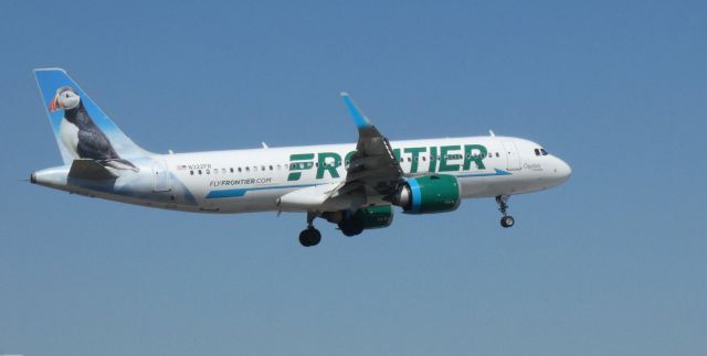 Airbus A320neo (N322FR) - On final is this 2017 Frontier Airlines Airbus 320-251N with "Captain" the Puffin looking back in the Spring of 2021.