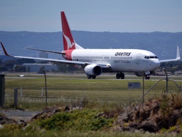 Boeing 737-800 (VH-VYC) - On taxi-way heading for take off on runway 05.