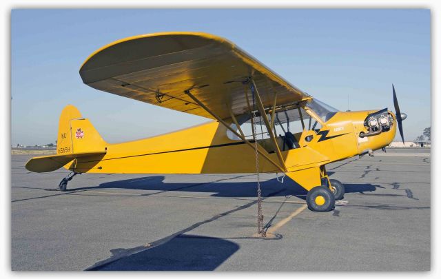 Piper NE Cub (N6565H) - 1946 PIPER J-3 sitting on the Merced Regional Airport ramp (KMCE)