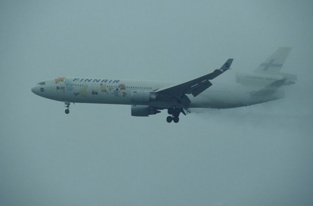 Boeing MD-11 (OH-LGC) - Final Approach to Narita Intl Airport Rwy34L on 1996/06/23 " Mumin c/s "
