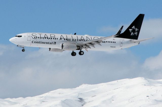 Boeing 737-800 (N26210) - With a snow covered Peavine Mountain in the background, this COA 737-800 approaches RTIAs runway 16R at the end of a flight from KIAH.  This pic was taken on the fourth day of new direct flight service between Houston and Reno.