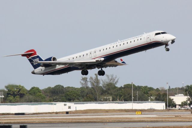 Canadair Regional Jet CRJ-900 (N912FJ) - Mesa Airlines/US Airways Express Flight 2647 (N912FJ) departs from Runway 14 at Sarasota-Bradenton International Airport enroute to Charlotte/Douglas International Airport