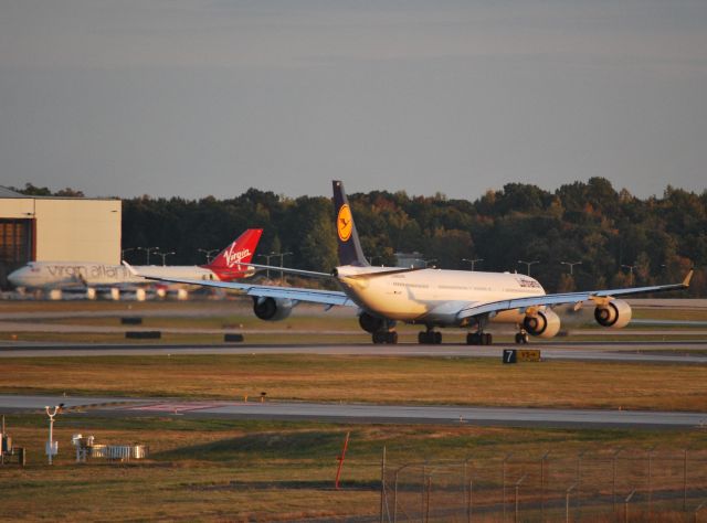 Airbus A340-600 (D-AIHT) - Rolling 18C with San Francisco 49ers chartered Virgin Atlantic 747 in the background - 10/10/24