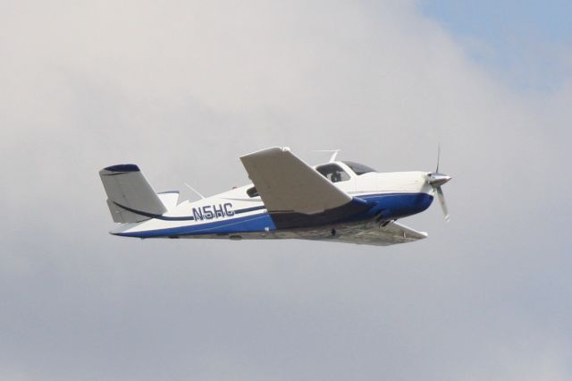 Beechcraft 35 Bonanza (N5HC) - N5HC departs Runway 14 at Sarasota-Bradenton International Airport enroute to Northwest Florida Beaches International Airport