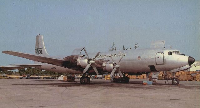 Douglas DC-7 (N868TA) - scanned from postcardbr /trans air link