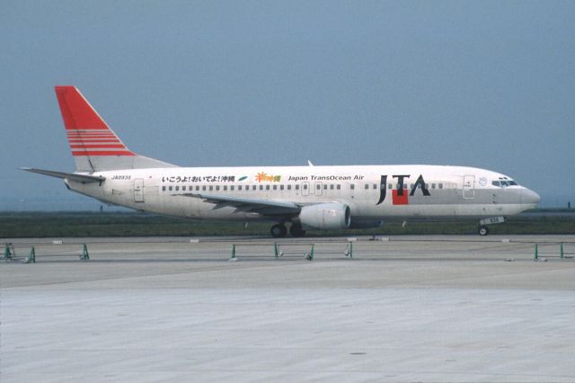 BOEING 737-400 (JA8939) - Taxing at Tokyo-Haneda Intl Airport on 2003/05/24 " Ikouyo! Oideyo! Okinawa Title "