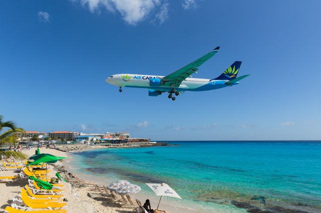 Airbus A330-200 (F-HHUB) - Air Caraibes Airbus A330-200 F-HHUB over maho beach for landing at TNCM St Maarten.